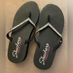 Skechers Yoga Foam flip flops. 8. Light multicolored gems on straps.